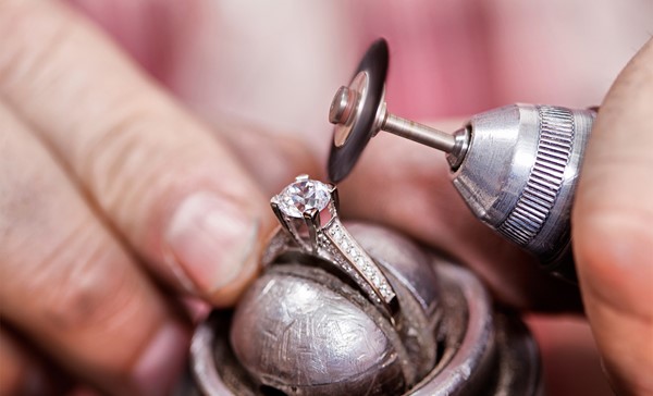 Jeweller polishing the diamond ring