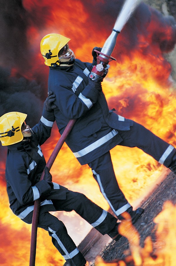 Firefighters wearing protective clothes