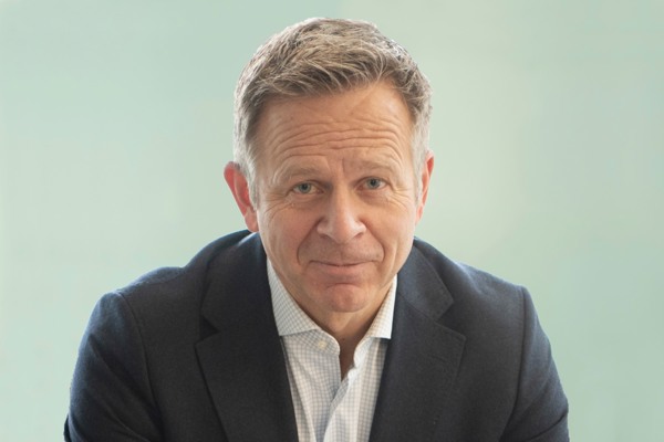 Portrait of Dag Teigland, looking at the camera with a neutral expression against a plain background.