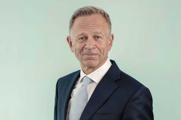 Portrait of Dag Teigland, looking at the camera with a neutral expression against a plain background.